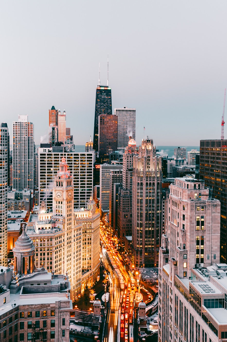 High-rise Buildings Under White Clouds